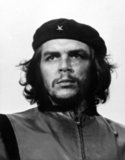 While living in Mexico City, Guevara met Raúl and Fidel Castro, joined their 26th of July Movement, and sailed to Cuba aboard the yacht, Granma, with the intention of overthrowing U.S.-backed Cuban dictator Fulgencio Batista. Guevara soon rose to prominence among the insurgents, was promoted to second-in-command, and played a pivotal role in the victorious two year guerrilla campaign that deposed the Batista regime.<br/><br/>

Following the Cuban Revolution, Guevara performed a number of key roles in the new government. These included reviewing the appeals and firing squads for those convicted as war criminals during the revolutionary tribunals, instituting agrarian reform as minister of industries, helping spearhead a successful nationwide literacy campaign, serving as both national bank president and instructional director for Cuba’s armed forces, and traversing the globe as a diplomat on behalf of Cuban socialism. Guevara left Cuba in 1965 to foment revolution abroad, first unsuccessfully in Congo-Kinshasa and later in Bolivia, where he was captured by CIA-assisted Bolivian forces and executed.