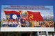 Laos: Revolutionary Socialist realist-style political poster on the streets of Vientiane